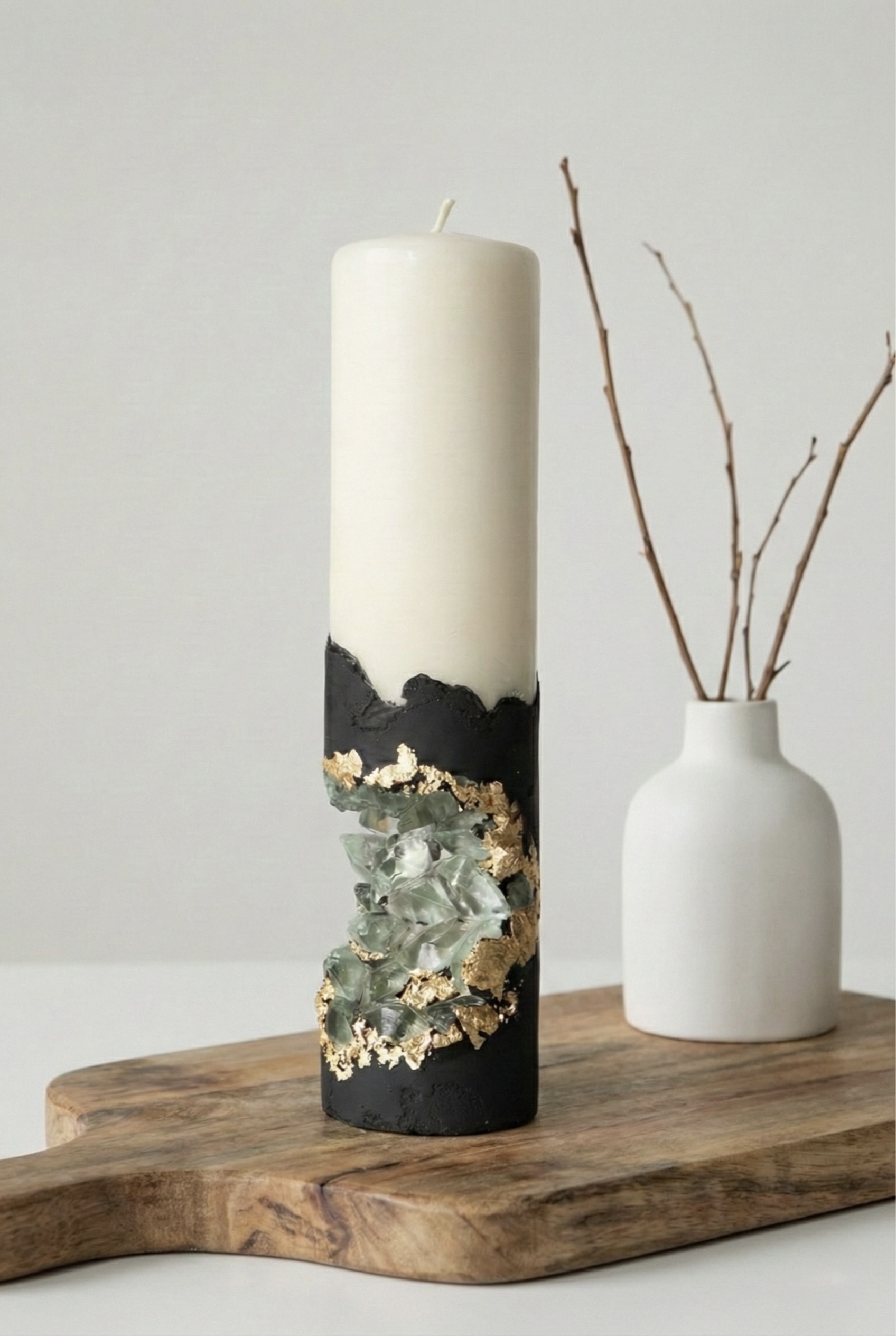 Black concrete pillar candle with an open geode-style crystal recess
